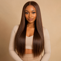 Black woman wearing a long chocolate brown 13x4 glueless straight human hair wig - front view