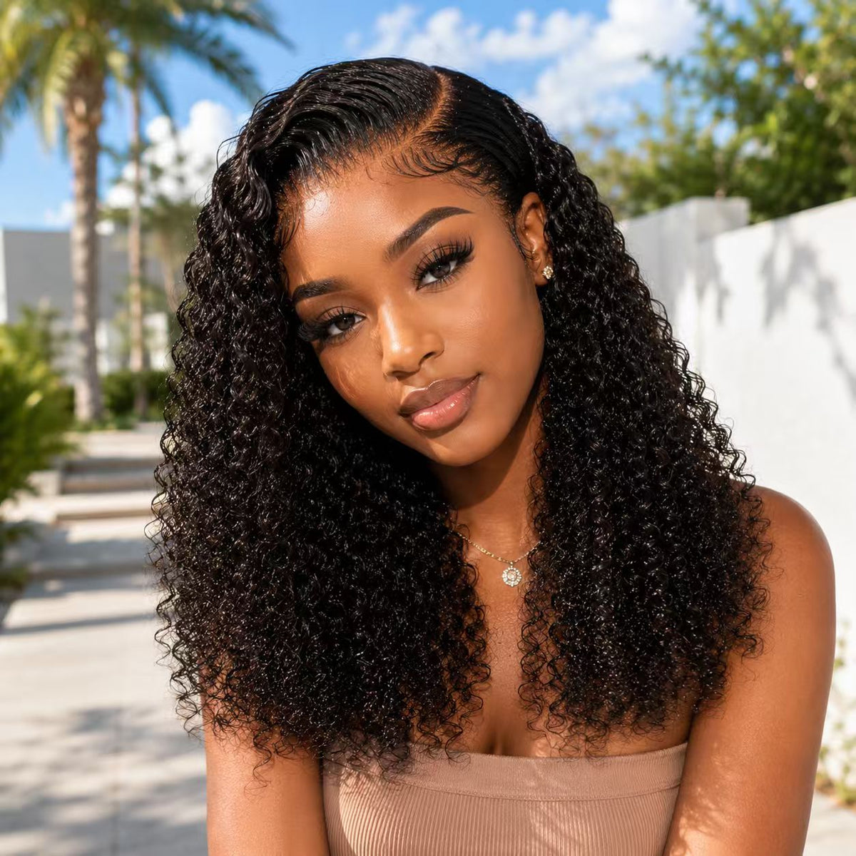 Model wearing a Natural Black Jerry Curly 13x4 wig from the two-wig bundle