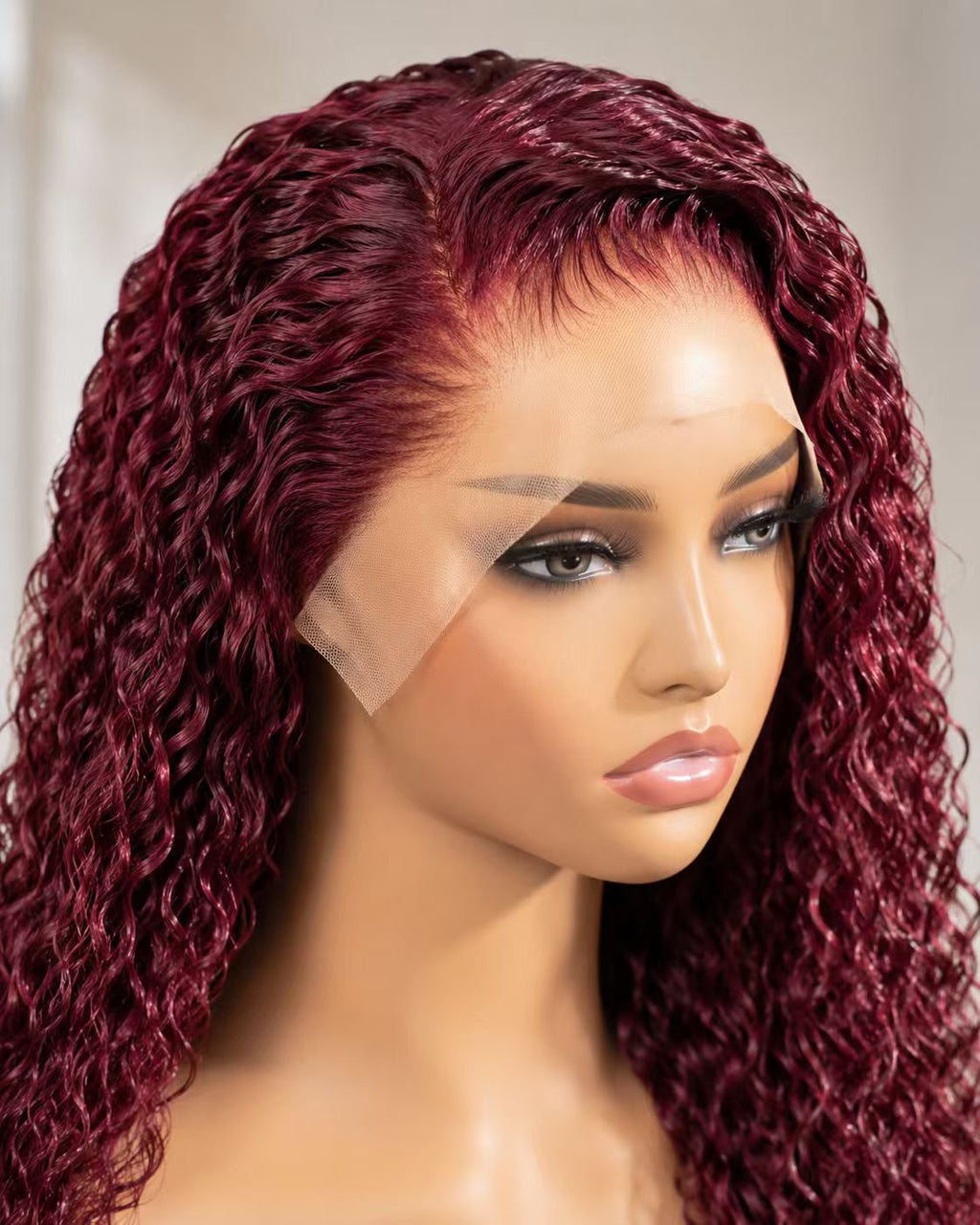 99J burgundy water wave 13x4 lace frontal human hair wig on mannequin