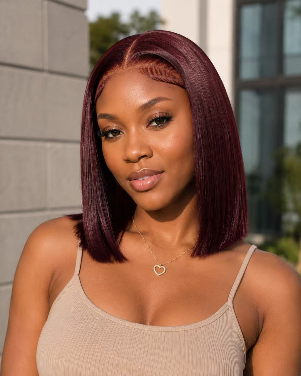 Model wearing a 99J burgundy 13x4 bone straight Vietnamese human hair wig